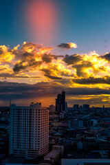 Fototapeta premium panoramic high-angle evening background of the city view,with natural beauty and blurred sunsets in the evening and the wind blowing all the time,showing the distribution of city center accommodation