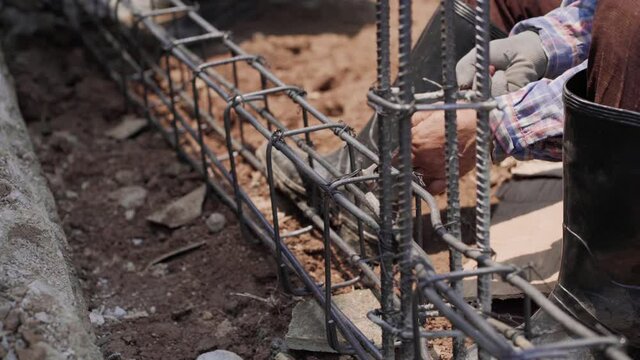 Meachanical annealing wire steel binding wall building outdoor construction site close up