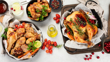Assorted grilled chicken meat and sauce on gray background. Homemade food concept.