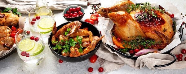 Assorted grilled chicken meat and sauce on gray background. Homemade food concept.