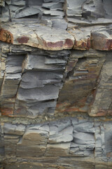 The texture and background of the stones. Rock texture on the sea coast