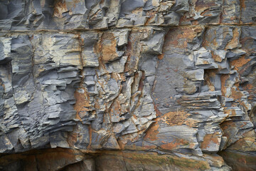 The texture and background of the stones. Rock texture on the sea coast