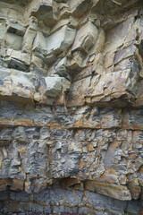 Fototapeta premium The texture and background of the stones. Rock texture on the sea coast