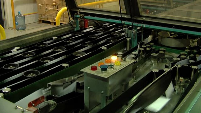 A Machine for Automatic Sorting of Mail Items is processing a Large Batch of Letters. Closeup. 