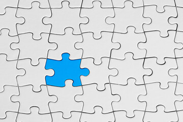Blue jigsaw puzzle piece stands out from the crowd. Diversity, unique or difference