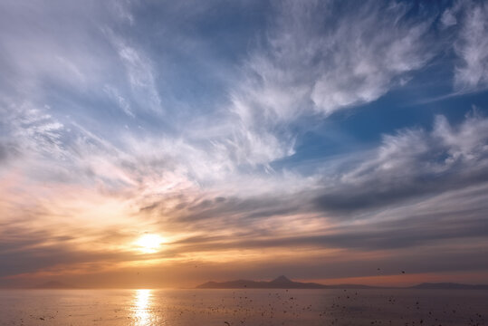 sunset over the ocean © Roman