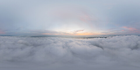 360 panorama by 180 degrees angle seamless panorama of aerial view of sunrise above fluffy sea fog misty clouds with mountain hill from Phu Tub Berk, Khao Kho, Phetchabun with sunlight. Nature