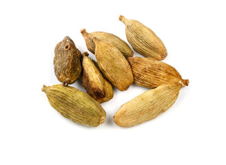 several dried Cardamom pods closeup on white