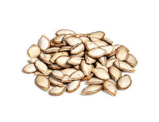 handful of unhusked Pumpkin seeds closeup on white