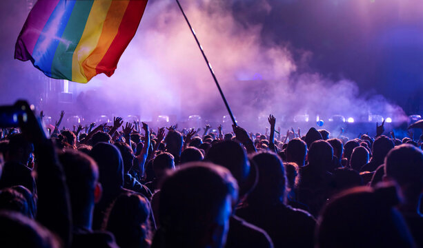 Gay parade with LGBT flag.