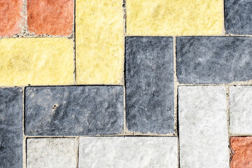 Background in the form of a close-up of colored paving slabs