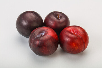 Ripe sweet plum fruit heap