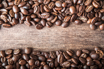 Coffee background close-up macro. Lots of coffee beans and copy space.