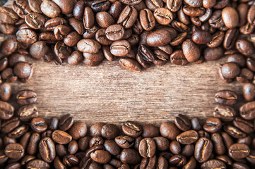 Coffee background close-up macro. Lots of coffee beans and copy space.