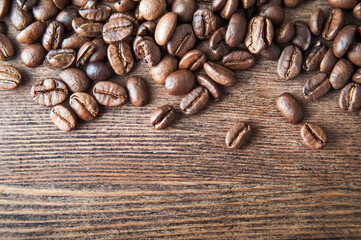 Coffee background close-up macro. Lots of coffee beans and copy space.