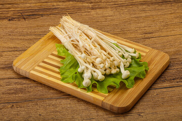 Raw Enoki mushrooms for cooking