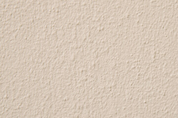 Plaster texture. Background of beige painted wall.