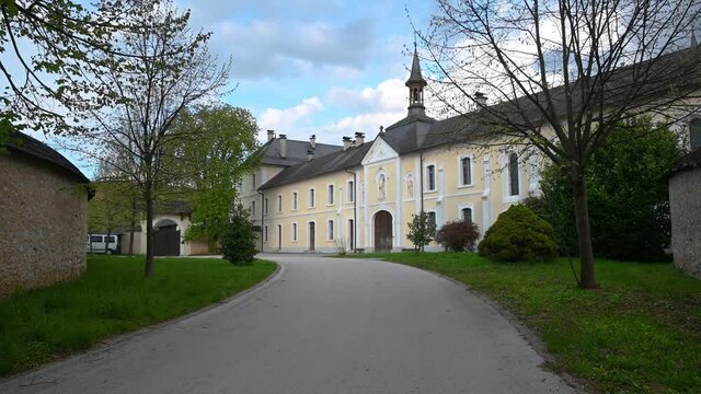 Pleterje Charterhouse in Slovenia, the only extant monastery of that order in the country. Close up view of the entrance. Tilt up, wide angle