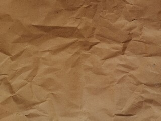 Texture background of dark brown crumple old paper