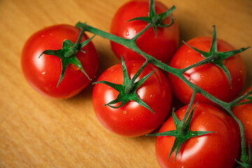 Cherry tomatoes on wood background