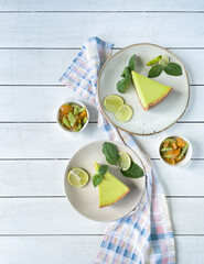 Composition with lemon cheesecake, fruit, top view, copy space.