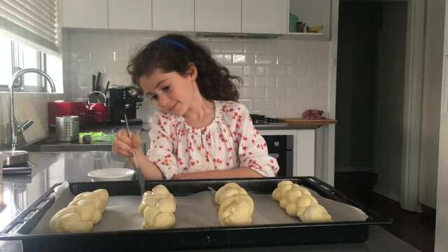 Jewish girl baking sweet Challah bread for Sabbath Jewish Holiday