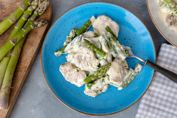 Pork tenderloin with asparagus in a cream sauce