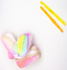 Crochet threads. Yarn of different colors and textures. Knitting needles and yarn.