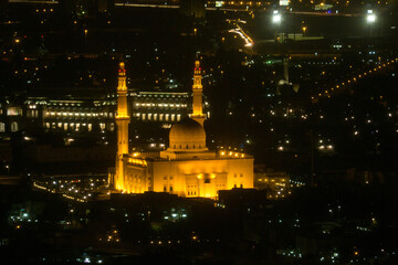 Fototapeta na wymiar Illuminated Dubai Mosque at Night