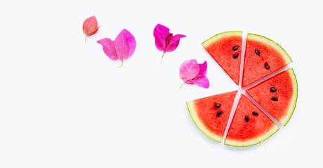 Watermelon with bougainvillea flower on yellow background.