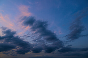 Obraz premium beautiful sunset sky, dark silhouette of clouds as a background