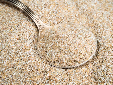 tablespoon in rye bran close up