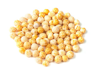 pile of dried whole yellow peas closeup on white