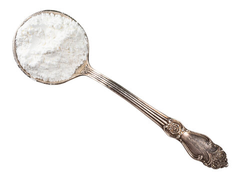 baking powder in silver tablespoon cutout