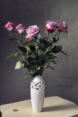 Still life with pink roses in vase