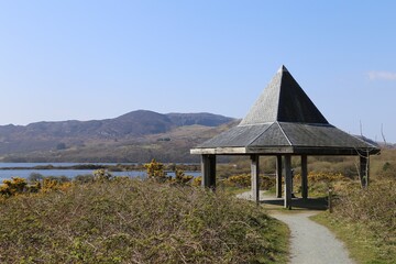 A picnic shelter and observation point on the man made lake at the decommissioned Trawsfynydd nuclear power plant site, Wales, UK.