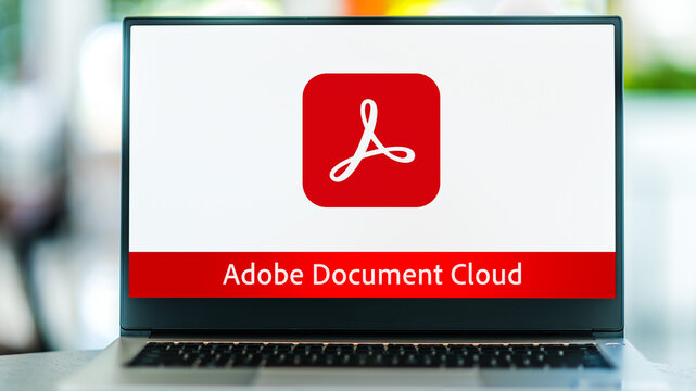 Laptop computer displaying logo of Adobe Document Cloud