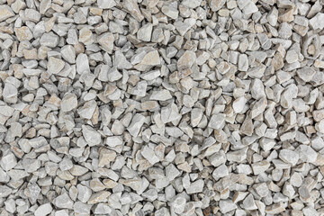 texture background of small white stones, used for sprinkling lawns and paths in parks