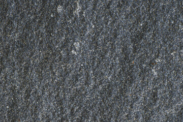 black stone texture with cracks and chips, background image