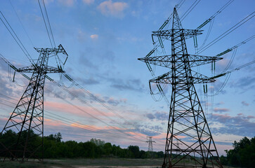High-voltage power lines on the background of a beautiful cloudy sky