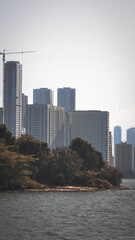 city skyline with the sea at sunset