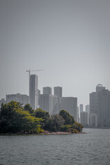 city skyline with the sea at sunset