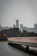 city skyline with the sea at sunset
