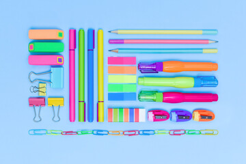 Office and school colourful stationery supply on blue background as knolling. Flat lay. Back to...