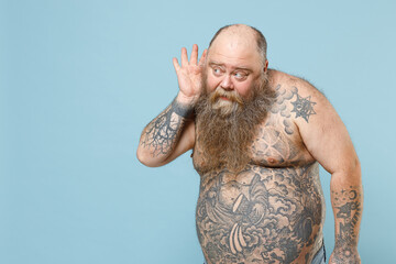 Young curious fun fat pudge obese chubby overweight blue-eyed bearded man 30s has big belly with...