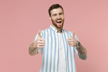 Young smiling happy satisfied caucasian unshaven man 20s wearing blue striped shirt white t-shirt...