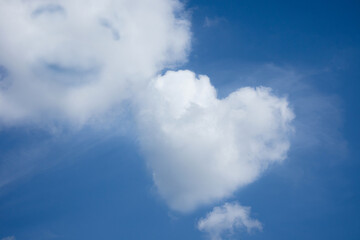 Heart shaped cloud on bright blue sky and white clouds, Symbol of pure love. concept of romantic love.