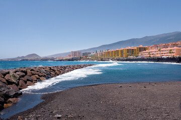 View of the village of Punta Larga near Candelaria on the south coast of the island of Tenerife, seen from a black sandy beach and with a view over the Atlantic.