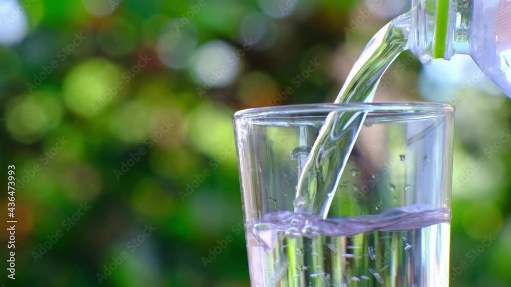 Wall mural 
Pouring drinking water on table and mineral water health care concept