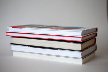 stack of different books with a side on a white background.